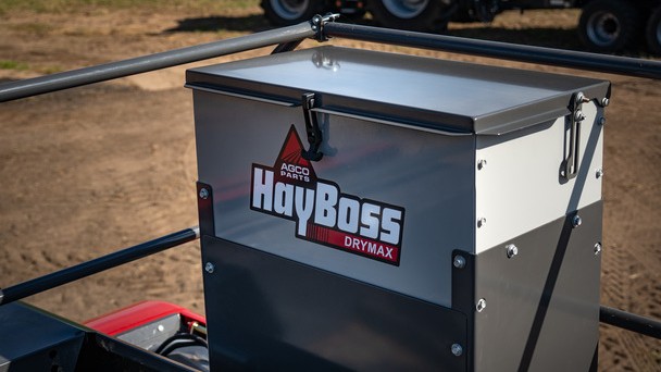 Image of HayBoss DryMax applictor installed on top of a baler.